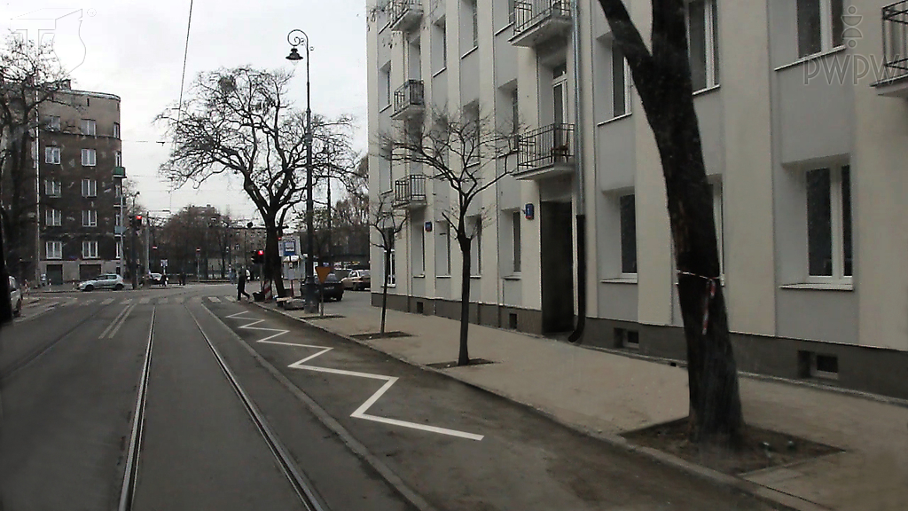 Does the visible broken line on the road indicate a parking place for the disabled?